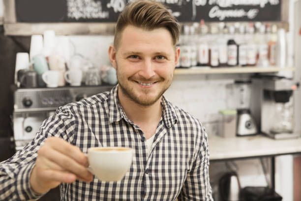 istock Barista working at his coffee shop 1152693179