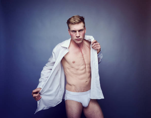 istock Handsome man wearing white shirt and underwear 1152693307