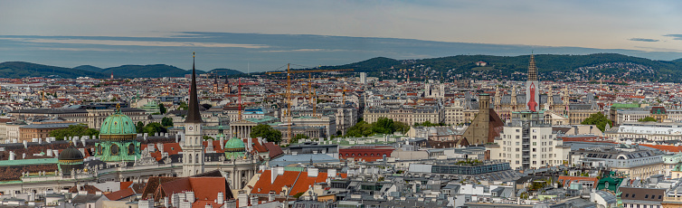 A panorama picture of the rooftops of Vienna featuring, among others, the Rathaus and The Hofburg.