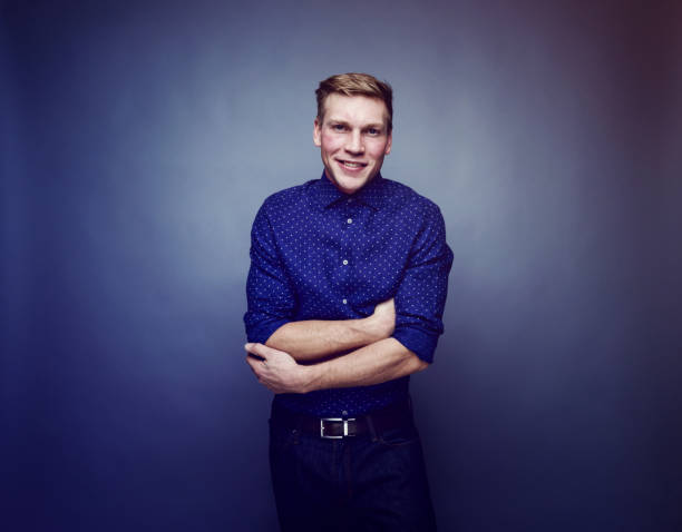 istock Handsome man wearing blue button down shirt 1152693963