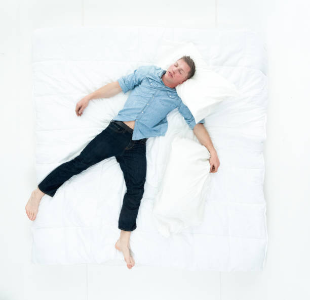 istock Above view of man resting in bed and sleeping 1152695432