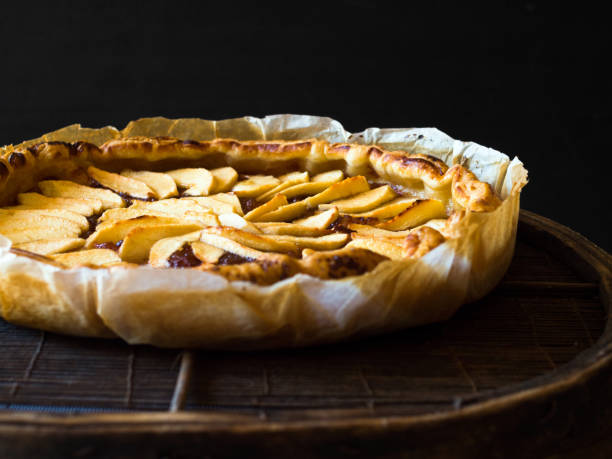 istock Homemade apple pie on black background 1152695665