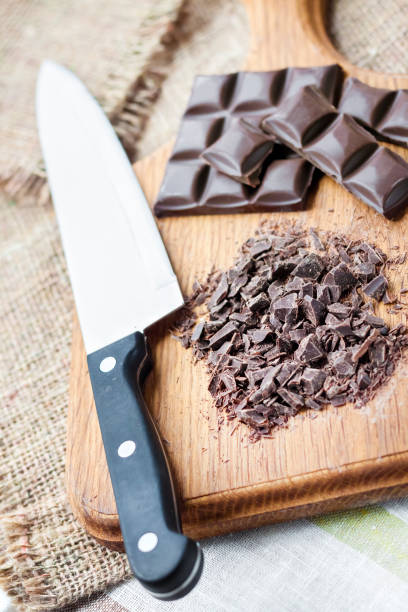 istock Chopped dark chocolate on wooden cutting board 1152696901