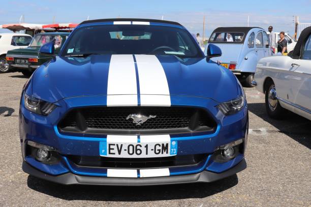 Ford Mustang coupe 2017 blue and white - sports car at the exhibition \