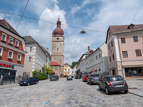 Waidhofen an der Ybbs - May 30 2019: The City Tower of Waidhofen an der Ybbs, called Stadtturm un German, with Stone Facade, Red Roof, Clock and Blue Sky on the Freisingerberg