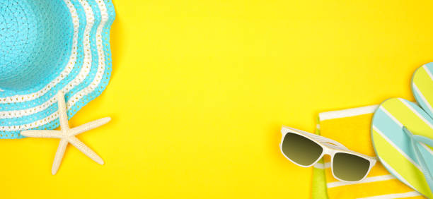 istock Summer vacation beach accessories banner on a yellow background with copy space 1152703875