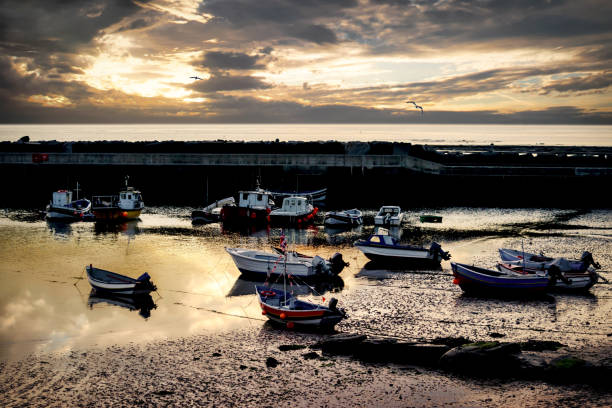 istock Harbour boats and sunrise, Staithes 1152704486