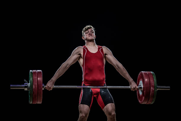 istock Young weightlifter lifting barbell 1152704904
