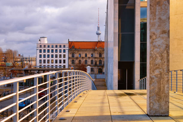 Bridge at Deutscher Reichstag building in Berlin, capital of Germany in winter on the street. German Bundestag parliament house. Fernsehturm TV tower on the background