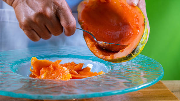 istock Closeup of hands holding a papaya 1152705128