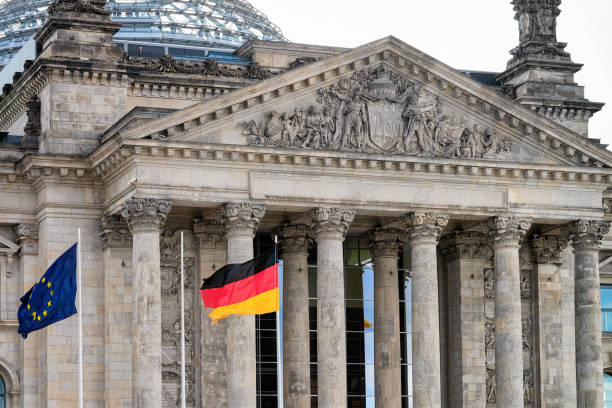 istock Reichstag building architecture and German and EU Flags in Berlin 1152706007