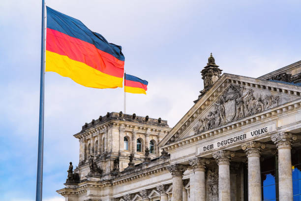 istock Reichstag building architecture and German Flags at Berlin 1152706012