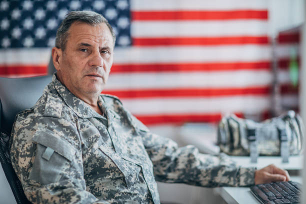 istock An old American soldier works in the office 1152709037