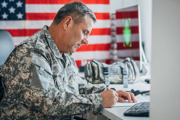 istock An old American soldier works in the office 1152709238