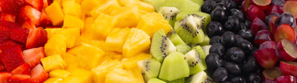 istock A Background of Rainbow Colored Fruit Salad in Rows 1152711165