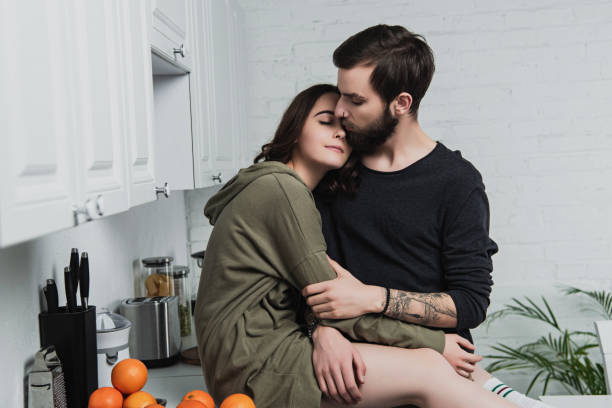 istock beautiful young couple embracing in kithchen during breakfast 1152714584