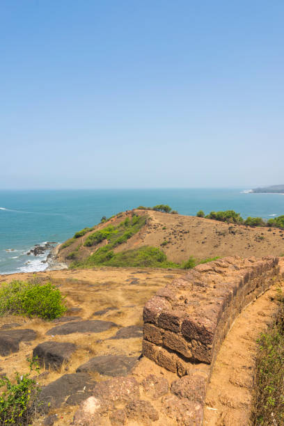 Chapora Fort in the northern Goa, India Anjuna, Goa / India - 04 03 2019, Chapora Fort in the northern Goa, India. Old ruins on top of hill. chapora fort stock pictures, royalty-free photos & images