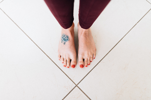 Overhead view of tattooed female foot