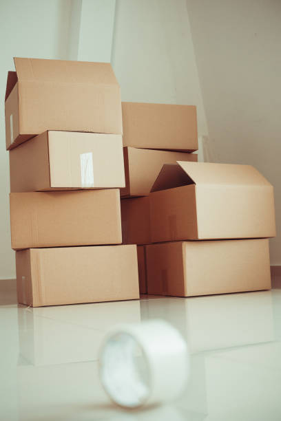 istock Duct tape and moving boxes on the floor 1152723827
