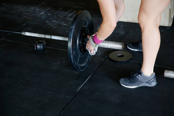 istock Fit woman get ready for weightlifting 1152724001