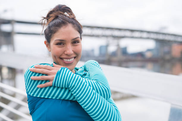 istock An woman stretches before going for a run in the city 1152724100