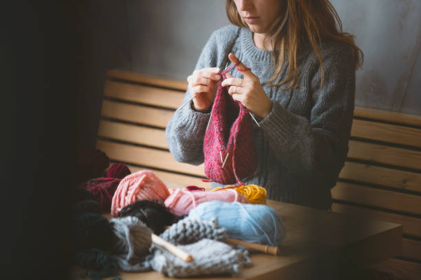 istock Close up on woman's hands knitting 1152724160