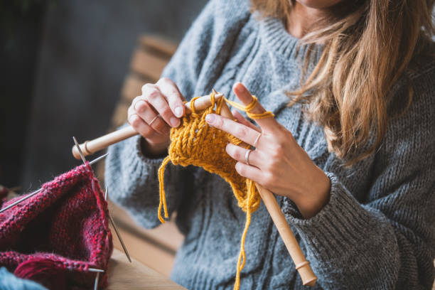 istock Close up on woman's hands knitting 1152724162