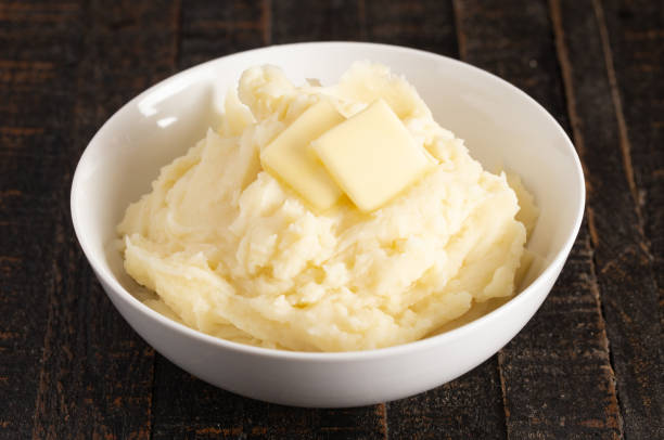 istock Homestyle Mashed Potatoes with Butter on a Wooden Table 1152727073