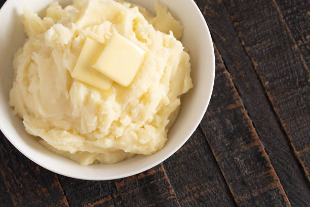 istock Homestyle Mashed Potatoes with Butter on a Wooden Table 1152727636