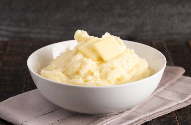 istock Homestyle Mashed Potatoes with Butter on a Wooden Table 1152727638