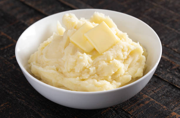 istock Homestyle Mashed Potatoes with Butter on a Wooden Table 1152727824