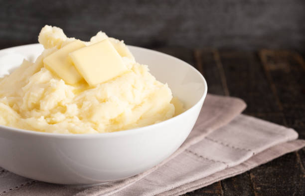 istock Homestyle Mashed Potatoes with Butter on a Wooden Table 1152729042