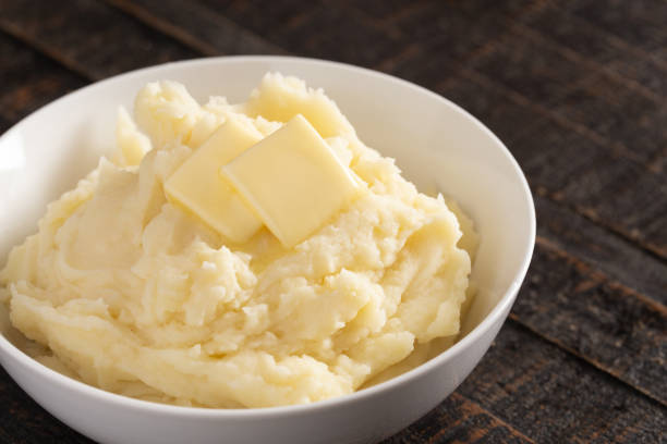 istock Homestyle Mashed Potatoes with Butter on a Wooden Table 1152730072