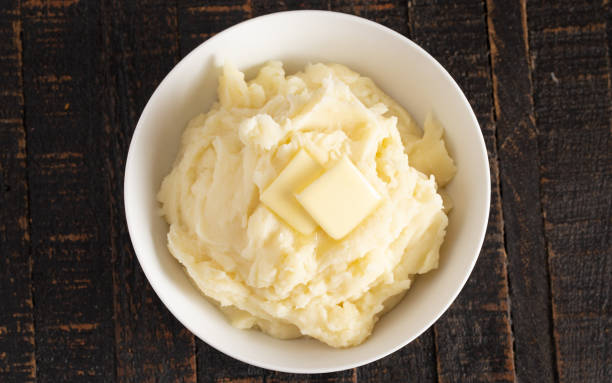 istock Homestyle Mashed Potatoes with Butter on a Wooden Table 1152730094