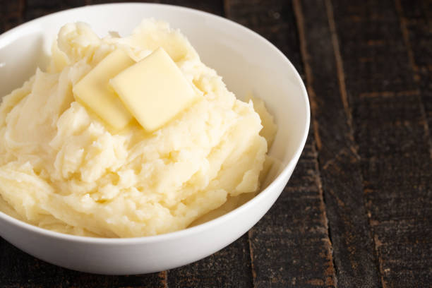 istock Homestyle Mashed Potatoes with Butter on a Wooden Table 1152732658