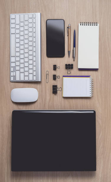istock Workspace with diary or notebook and clipboard, laptop, mouse computer, keyboard, smart phone, pencil, pen on wooden background 1152736554