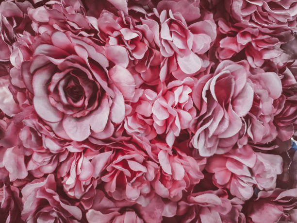 istock beautiful artificial flowers background, vintage style; 1152742115