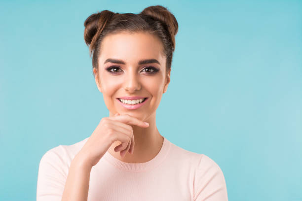 istock beautiful brunette smiles 1152744140