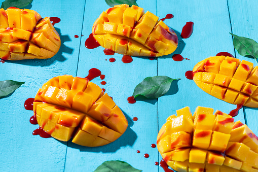 Mexican snack: Cutted tropical mango fruit with chilli \