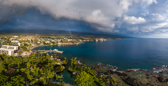Aerial panorama of the city of Kailua Kona with rainbow in the sky. Big Island, Hawaii
