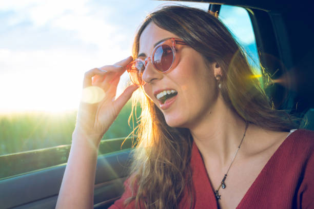 istock Young woman in a car with open window 1152754625