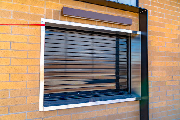 istock Close up of a building with glossy industrial roller shutter on the window 1152757148