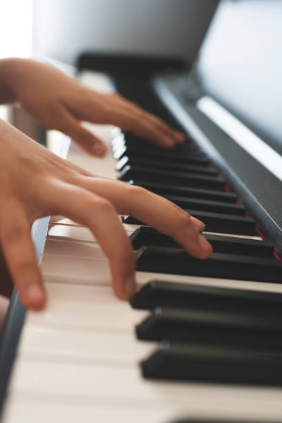 istock piano and playing piano 1152758497
