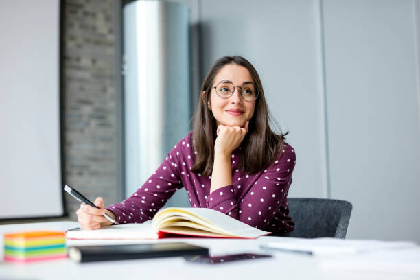 istock Young woman working in office 1152762483