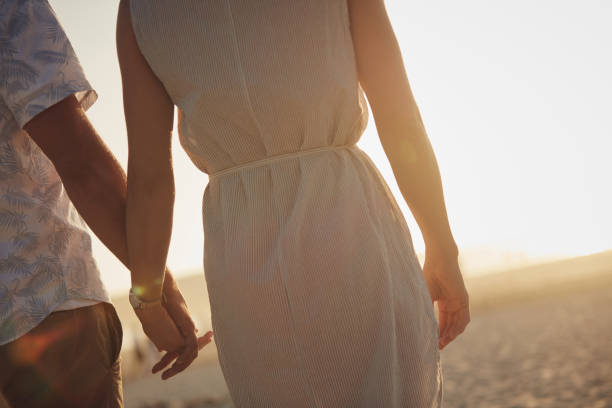 Cropped shot of an unrecognizable couple holding hands