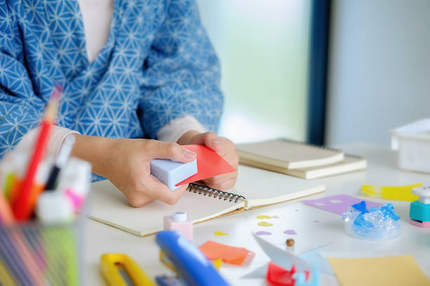 istock Female hands making paper art. Do it yourself concept 1152764809