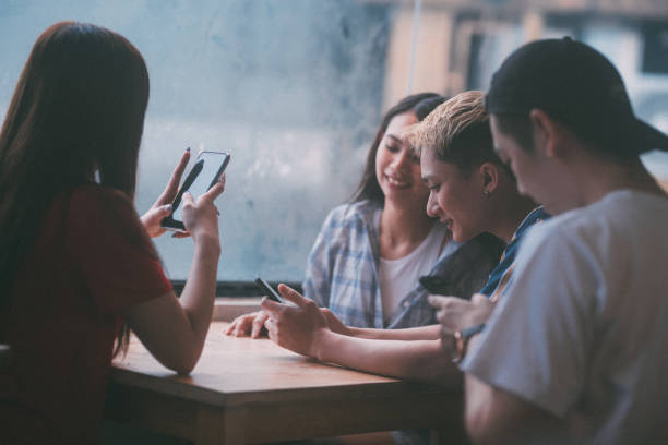 istock Group of Asian young people using smart phone 1152765025