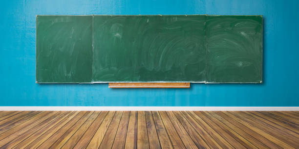 istock Blank green chalkboard, blackboard texture with copy space hangs on blue grunge wall and wooden floor 3D-Illustration 1152765224