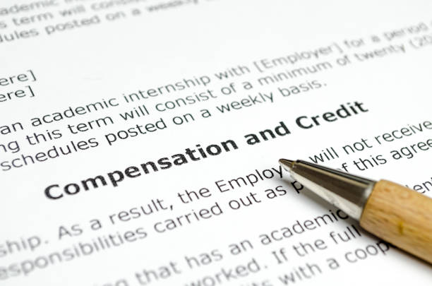 istock Compensation and Credit with wooden pen 1152767713