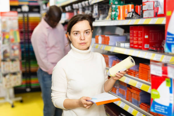 istock Woman choosing office supplies 1152768917